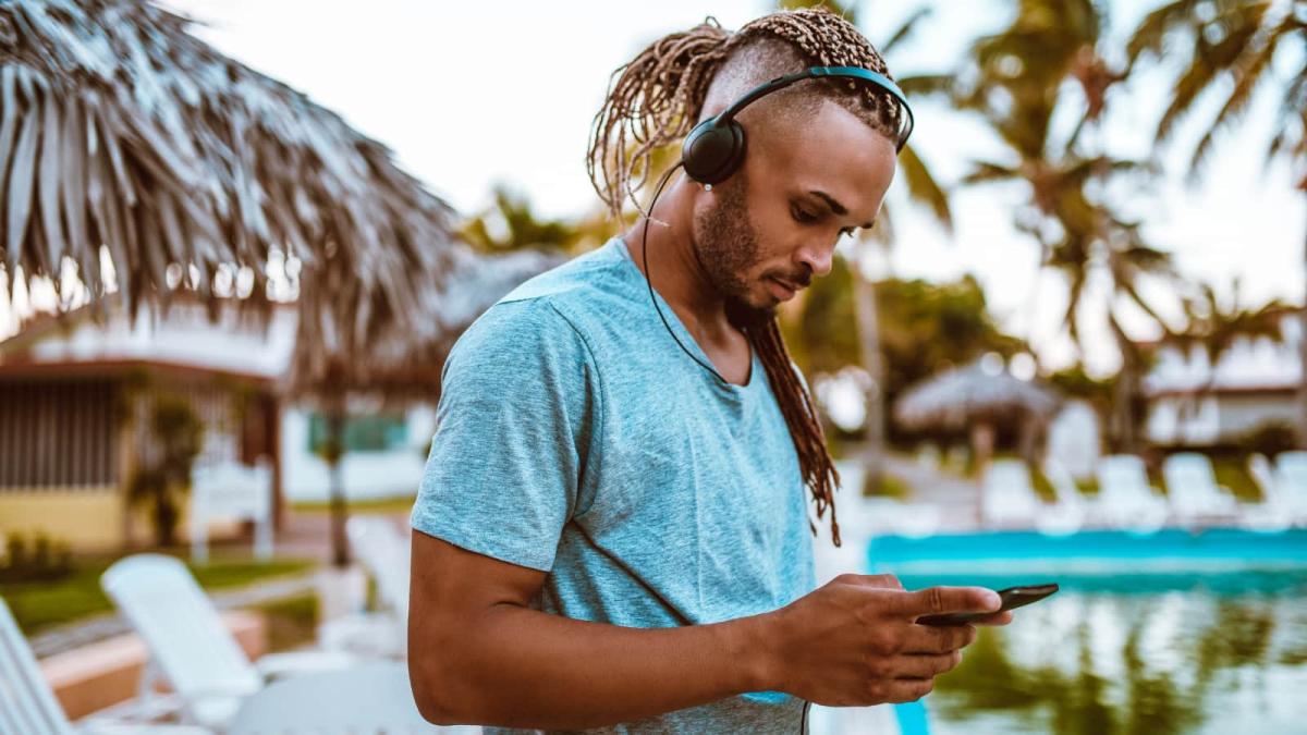 Man using conferencing app on his smartphone in Costa Rica.