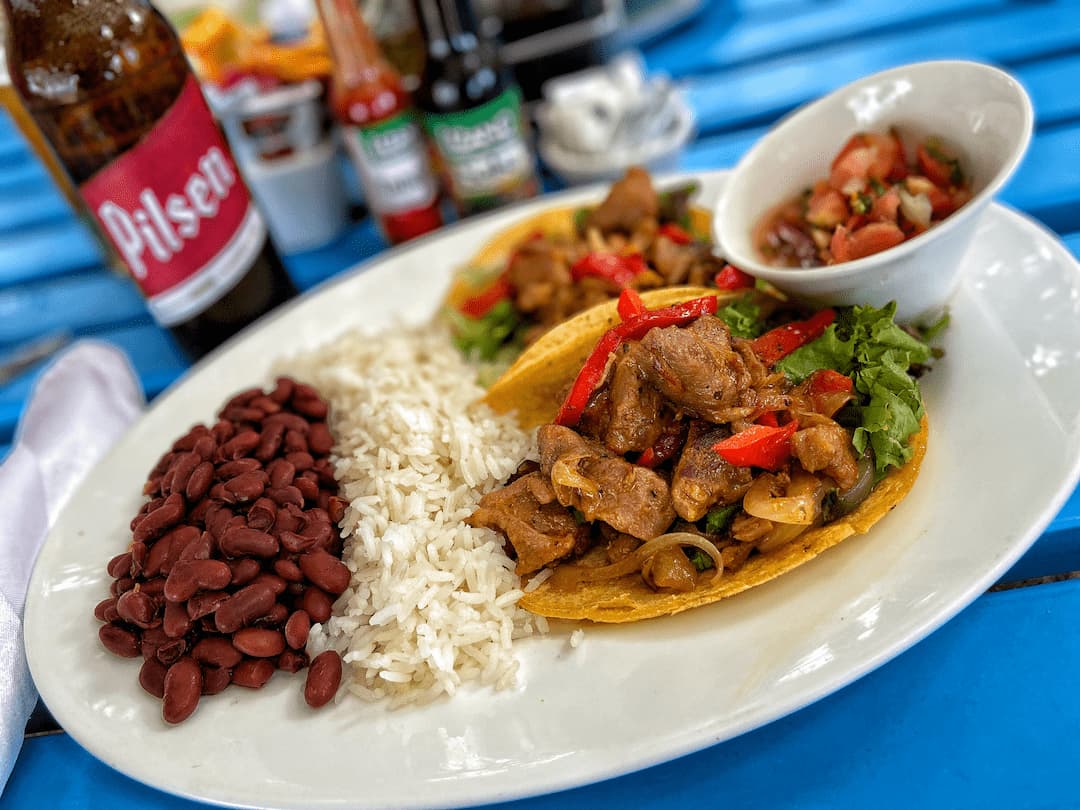 Tico tacos, arroz, frijoles, pico de gallo, and a beer!